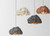 The rock style pendant lamp is a unique and eye-catching piece of lighting that will add character and texture to any space. With its rough and natural-looking exterior, it creates a warm and inviting atmosphere. The lamp is made from high-quality materials that are both durable and stylish, ensuring that it will last for years to come. The pendant light features a unique design that makes it stand out from other lighting fixtures, making it a perfect addition to any home or office space. It is a great way to incorporate natural elements into your interior design while also providing functional lighting. The rock style pendant lamp is a must-have for anyone who appreciates unique and modern lighting that is both stylish and functional.
