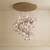 calliope chandelier, fairytale chandelier, whimsical spaces, porcelain flowers, floral chandelier, pink floral chandelier, luxury lighting, handmade porcelain lighting, unique lighting design, modern luxury chandelier, elegant home decor, enchanting decor, fantasy lighting, botanical chandelier, artisanal chandelier, custom luxury lighting, decorative ceiling light, premium lighting fixture, magical interior design, whimsical home aesthetic, fairytale aesthetic lighting, porcelain bloom chandelier, pastel aesthetic decor, delicate floral lamp, romantic interior lighting,