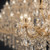 chandelier, crystal chandelier, luxury chandelier, ornate lighting, crystal drops, faceted crystals, vintage chandelier, glass arms, gold fixture, glowing bulbs, candlelight effect, high-end interior, decorative lighting, sparkling crystals, intricate design, classic elegance, traditional lighting, reflective surfaces, warm illumination, premium hardware, crystal pendants, cut glass, multi-tier, brilliant shine, sophisticated fixture, heirloom quality, opulent aesthetic, polished metal, architectural lighting, grand decor