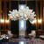 Discover the enchanting allure of Blossom Artificial Trees by Blanco. Crafted with meticulous attention to detail, these lifelike replicas bring the beauty of spring into any space, year-round. Adorned with delicate blooms and gracefully arched branches, our artificial blossom trees exude timeless elegance and sophistication. Whether used as standalone accents or integrated into larger landscaping projects, they add a touch of natural charm to gardens, patios, weddings, and events. With their durable construction and effortless maintenance, Blanco's Blossom Artificial Trees offer a convenient and stunning solution for enhancing your surroundings with the magic of blossoming springtime.