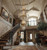 Style: Transitional modern, contemporary luxury, modern rustic

Architecture: Double-height ceiling, floor-to-ceiling glass windows, floating staircase, glass railing, open-plan foyer

Lighting/Fixtures: 3-tier crystal chandelier, brass and crystal chandelier, grand statement lighting

Interior Elements: Minimalist plaster walls, large-format grey tile flooring, fiddle-leaf fig plant, geometric wool rug, floating wood console