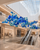 Naola Sculptural Blue Glass Chandelier for Luxury Shopping Malls
A wide architectural view showcasing Naola as a suspended art-glass installation above a grand shopping mall escalator. The varied cobalt, turquoise and clear-blue glass spheres create depth and movement while providing an eye-catching centrepiece for multi-storey retail and hospitality environments.