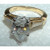 luxury pear cut diamond ring, 1.81 carat diamond ring, VS1 VVS1 clarity diamonds, F color diamond jewelry, three-stone engagement ring, high jewelry pear diamond, tapered baguette diamond accents, bespoke two-tone gold ring, natural earth-mined diamonds, fine jewelry craftsmanship, 14K white and yellow gold ring, collector’s diamond ring, investment-grade diamond jewelry, sophisticated diamond engagement ring, exclusive designer diamond ring