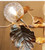 gold leaf chandelier detail

antique gold chandelier close-up

glass globe chandelier lighting detail

luxury chandelier gold finish

decorative leaf chandelier design