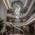 EROS The Signature model, a luxury linear statement chandelier with hand-crafted glass shards, featured as a modern accent in a high-end luxury entryway."