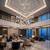 Installed in a grand luxury hotel lobby, the NORLO large statement chandelier commands attention with its soaring vertical presence and warm illumination. The multi-story design harmonizes seamlessly with high ceilings, marble finishes, and upscale hospitality seating areas.