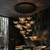 The Round Cluster Chandelier fits cozy lounges with an 80 cm canopy, 90 cm width, 150 cm to 250 cm drop, and 18 glass pieces.