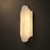 Lucienne Large Spanish Alabaster Wall Light – 75cm Luxury Art Deco Hotel Sconce

Close-up of the Lucienne large Spanish alabaster wall light, featuring a sculptural 75cm stepped Art Deco design illuminated with warm 3000K LED light. The translucent natural alabaster creates a soft architectural glow against a dark luxury interior, ideal for five-star hotels, grand bedrooms, staircases, hallways, villas and sophisticated hospitality spaces.