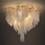 Celestine 100cm Hollywood Regency Tassel Chain Flush Mount Chandelier
Celestine 100cm Hollywood Regency flush mount chandelier, featuring cascading silver-tone chain tassels suspended from a sculptural gold-finish frame. The dramatic layered fringe and warm illumination create a glamorous Art Deco-inspired statement ceiling light for luxury living rooms, bedrooms, hotels, restaurants and sophisticated villa interiors.