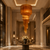 Amber Glass Hotel Lobby Chandelier
A spectacular hotel lobby setting showcasing the amber glass waterfall chandelier as a dramatic focal point. Suspended above a refined central table arrangement, the chandelier brings warmth, scale and luxury to the grand entrance space, making it ideal for premium hospitality interiors.