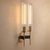 America Double Glass Wall Light – Brass & Black Art Deco Sconce
America luxury double glass wall light featuring tall fluted glass shades, warm brass stems and contrasting black detailing, photographed against an elegant beige background. A sophisticated Art Deco wall sconce for luxury living rooms, bedrooms, hallways, hotels and restaurants.