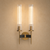 America Art Deco Double Wall Sconce – Front View
Front view of the America double wall sconce with symmetrical fluted glass shades, brass detailing and black accents. A statement luxury wall light designed for high-end residential interiors, boutique hotels, restaurants and contemporary Art Deco spaces.