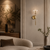 Valeria Brass Globe Wall Light – Quiet Luxury Living Room
Valeria modern brass globe wall light featured in a sophisticated quiet-luxury living room with curved seating, warm neutral wall panelling and natural textures. The clear glass globe and slender brass design create an elegant mid-century inspired statement light for contemporary living rooms, lounges and high-end residential interiors.
