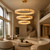 Australia 150cm Alabaster Chandelier – Luxury Double-Height Living Room
Australia grand alabaster ring chandelier featured in a high-end double-height residential living room with curved architecture, warm neutral finishes and contemporary furniture. The three illuminated 150cm, 120cm and 90cm rings create a sophisticated statement light for luxury villas, penthouses and large modern homes