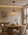 Lunara Flower Pendant Light in a Luxury Japandi Dining Room
The Lunara sculptural flower pendant light suspended above a warm oak dining table in a refined Japandi interior. Soft plaster walls, natural timber and understated furnishings complement the glowing petal-shaped shade, creating a calm and sophisticated dining space.
