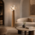 Kaori Japandi Flower Floor Light in an Elegant Lounge
The Kaori flower floor lamp featured in a sophisticated lounge with curved seating, natural stone and soft plaster finishes. Its sculptural silhouette creates a striking decorative focal point while maintaining the quiet, organic character of the interior.