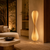Aveline Sculptural Floor Light in a High-End Hotel Lounge
The Aveline slatted floor lamp featured in a sophisticated hotel lounge with rich wood panelling, stone finishes and curved designer seating. Its flowing hourglass shape and warm ambient illumination create a distinctive focal point for boutique hotels, luxury hospitality spaces and private lounges.