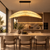 The Nami large fabric pendant light displayed above a premium stone kitchen island in a sophisticated contemporary home. Its broad crescent-like form and warm diffused light make it an elegant statement piece for kitchen islands, breakfast spaces and high-end residential interiors.