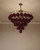 Thion chandelier, burgundy glass chandelier, tiered brass light fixture, luxury Italian style lighting, 80cm statement chandelier, designer ruby glass ceiling light, high-end dining room lighting, gold and burgundy decor, modern luxury ceiling fixture, elegant interior lighting, premium brass chandelier, deep red glass pendant, contemporary Italian lighting, luxury home decor, sophisticated dining light, grand foyer chandelier, artisan glass lighting, upscale living room light, interior design centerpiece, bespoke lighting fixture, brushed brass ceiling light, wine-colored glass chandelier, luxury kitchen chandelier