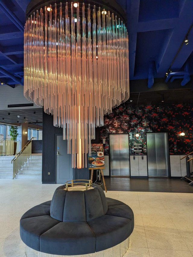 a chandelier in a hotel lobby a chandelier in a hotel lobby