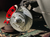 Installed Baer Classic front rotor and red caliper with the wheel removed