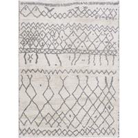 Andorra charcoal & beige polypropylene rug with global geometric patterns on a light background.