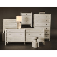 White Hampton mahogany side table with three drawers and metal pulls.