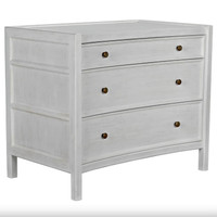 White distressed mahogany Hampton side table with three drawers and metal pulls.