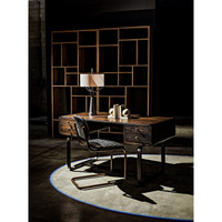 Malic Dark Walnut Bookshelf, 88"H, with varied cubbies behind a dark wood desk and chair.