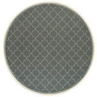 Round Marina Grey & Ivory Outdoor Rug with a quatrefoil pattern and polypropylene looped yarn.