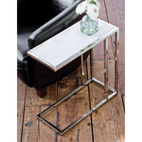 Echelon sofa hugger table with white marble top and polished nickel iron frame, next to a black armchair.