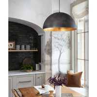 Large black dome pendant light with a gold interior hanging in a modern kitchen.