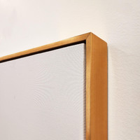 Close-up of a gallery-wrapped giclee canvas painting with a gold floating frame, showing texture.
