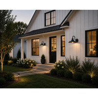 Elegant house exterior with well-maintained garden and lighting fixtures.