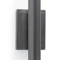 Redford Sconce in oil rubbed bronze steel, featuring a rectangular backplate with gold trim.