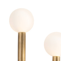 Modern Happy Sconce with natural brass frame and two matte white glass globes.