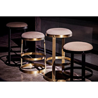 Four Dior Counter Stools: two black steel with linen seats, two antique brass with linen seats.