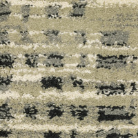 Close-up of Seneca Beige & Grey Casual Rug, showing dense polypropylene pile with abstract black, ivory, and grey patterns.