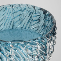 Hand-formed blue cast glass decorative bowl with textured surface and unique light effects.