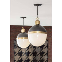 Two Otis large blackened natural brass pendants with translucent white milk glass globes.