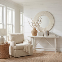 Mirabelle Bone Mirror: Round sunburst design with detailed bone accents in a bright, elegant room.