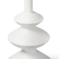 Matte white accent table with complex, paper mache-inspired curves and unique texture.