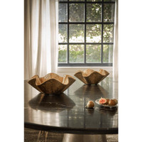 Two gold metallic Pedicoat bowls with ruffled edges on a dark table, with figs nearby.