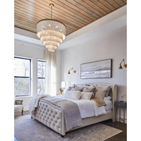 Waterfall White Beaded & Rattan Chandelier with cascading white beads and a jute-wrapped frame in a bedroom.