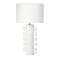 White Sanya Metal Table Lamp with a textured, sculptural base and a matching linen drum shade.