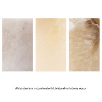 Three rectangular alabaster samples showing natural variations in white, light yellow, and light brown.