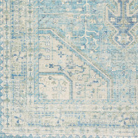 Zainab Sky Blue hand-woven cotton-polyester rug with traditional patterns in blue, navy, sage, and white.