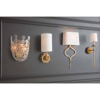 Antique gold leaf Clove Sconce with a white linen shade on a dark gray wall.