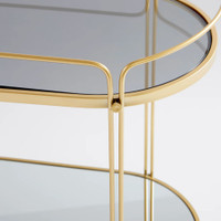 Elegant gold metal bar cart with two tempered glass shelves.