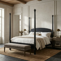 Douglas Four Poster Bed in hand-rubbed black mahogany with decorative finials, white bedding, and a beige bench.